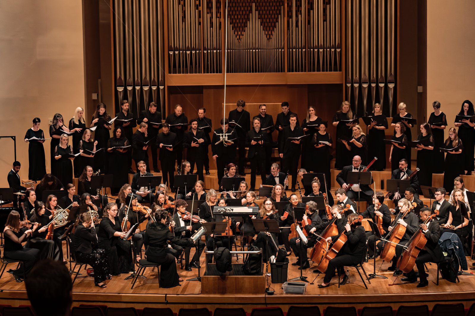 Kristi playing clarinet with an orchestra